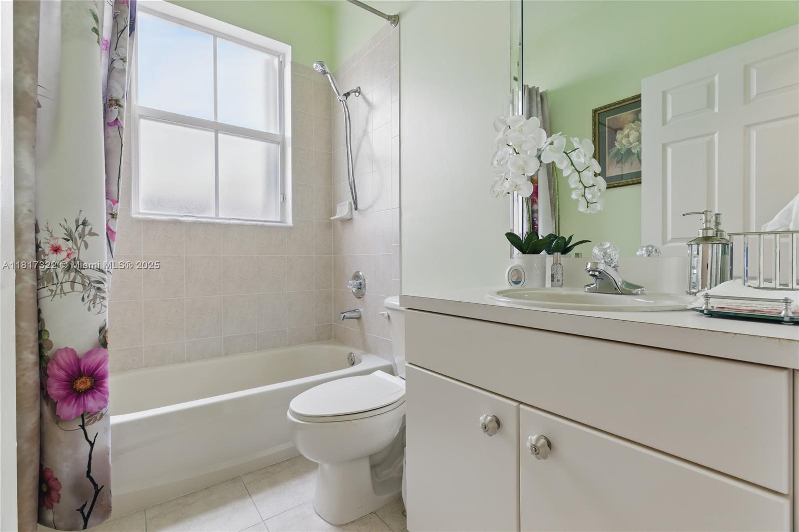 12251 Southwest 122nd Path Miami, FL 33186 - Photo 13 of 56 a bathroom with a sink a toilet and shower