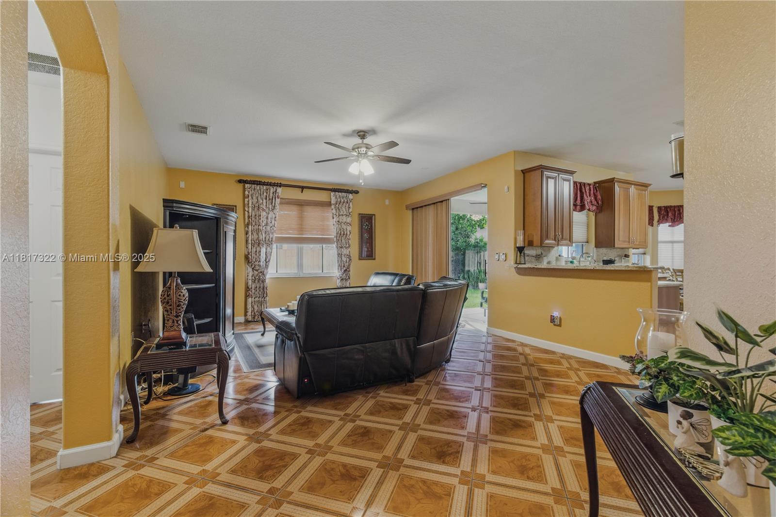 12251 Southwest 122nd Path Miami, FL 33186 - Photo 14 of 56 a living room with furniture a flat screen tv and a table