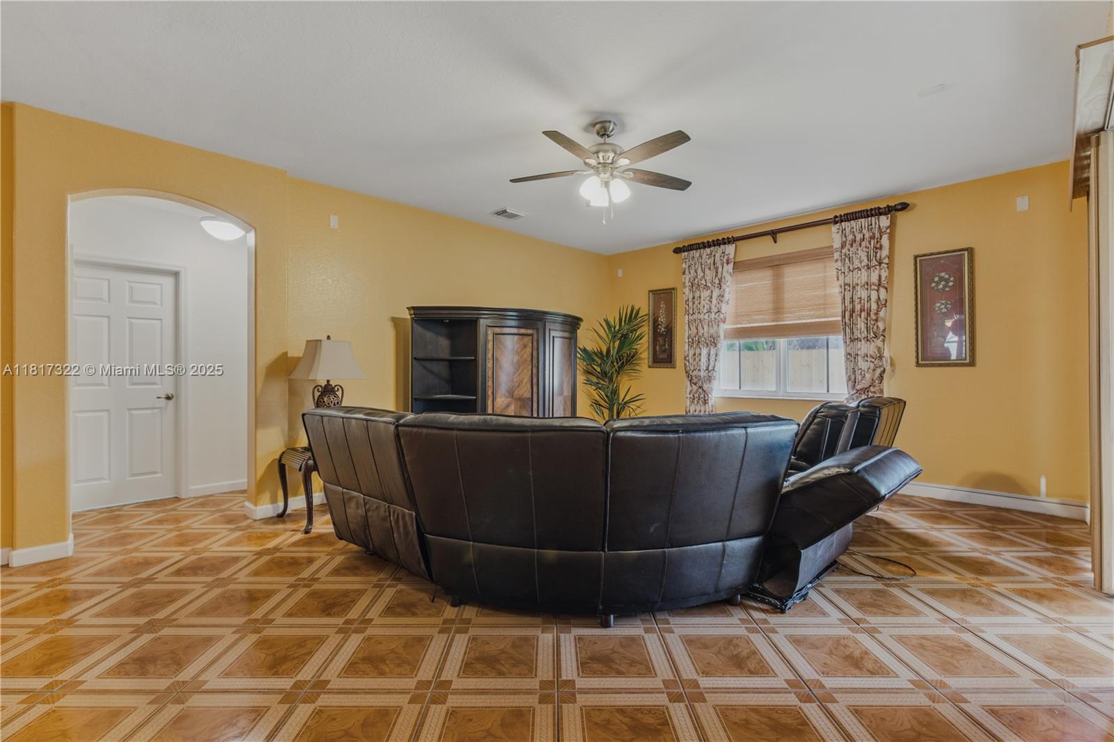 12251 Southwest 122nd Path Miami, FL 33186 - Photo 15 of 56 a living room with a couch and a table