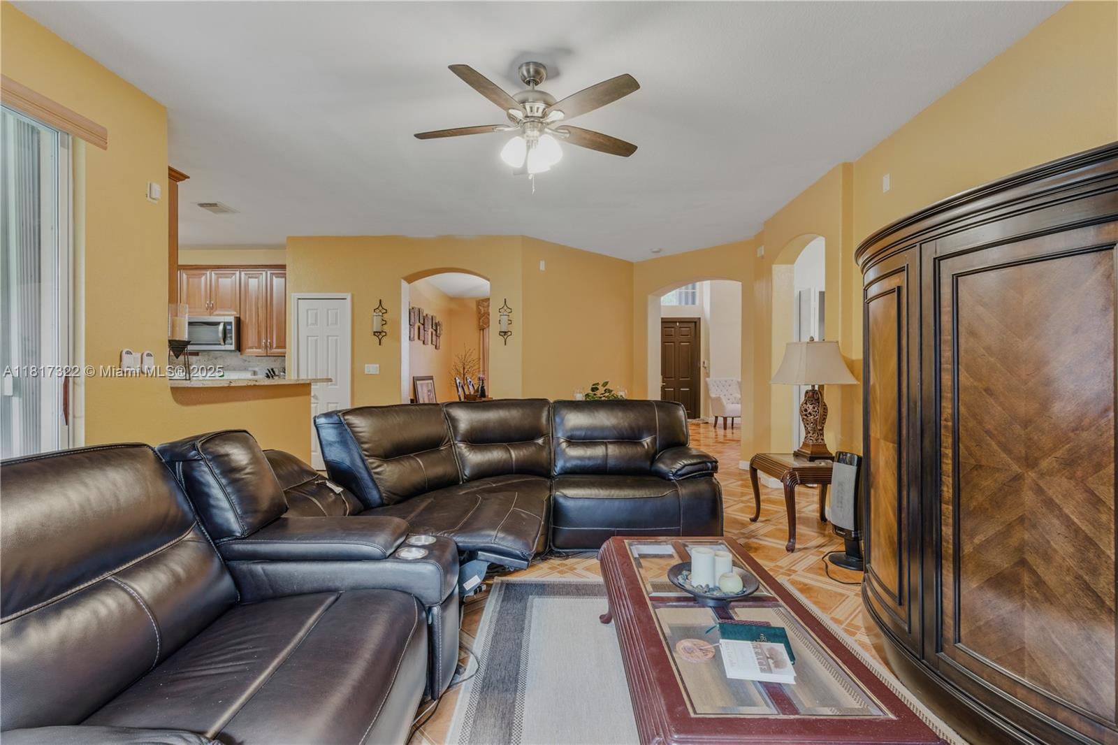 12251 Southwest 122nd Path Miami, FL 33186 - Photo 16 of 56 a living room with furniture and a large window