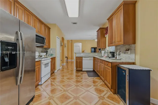 a utility room with multiple dryer and washer