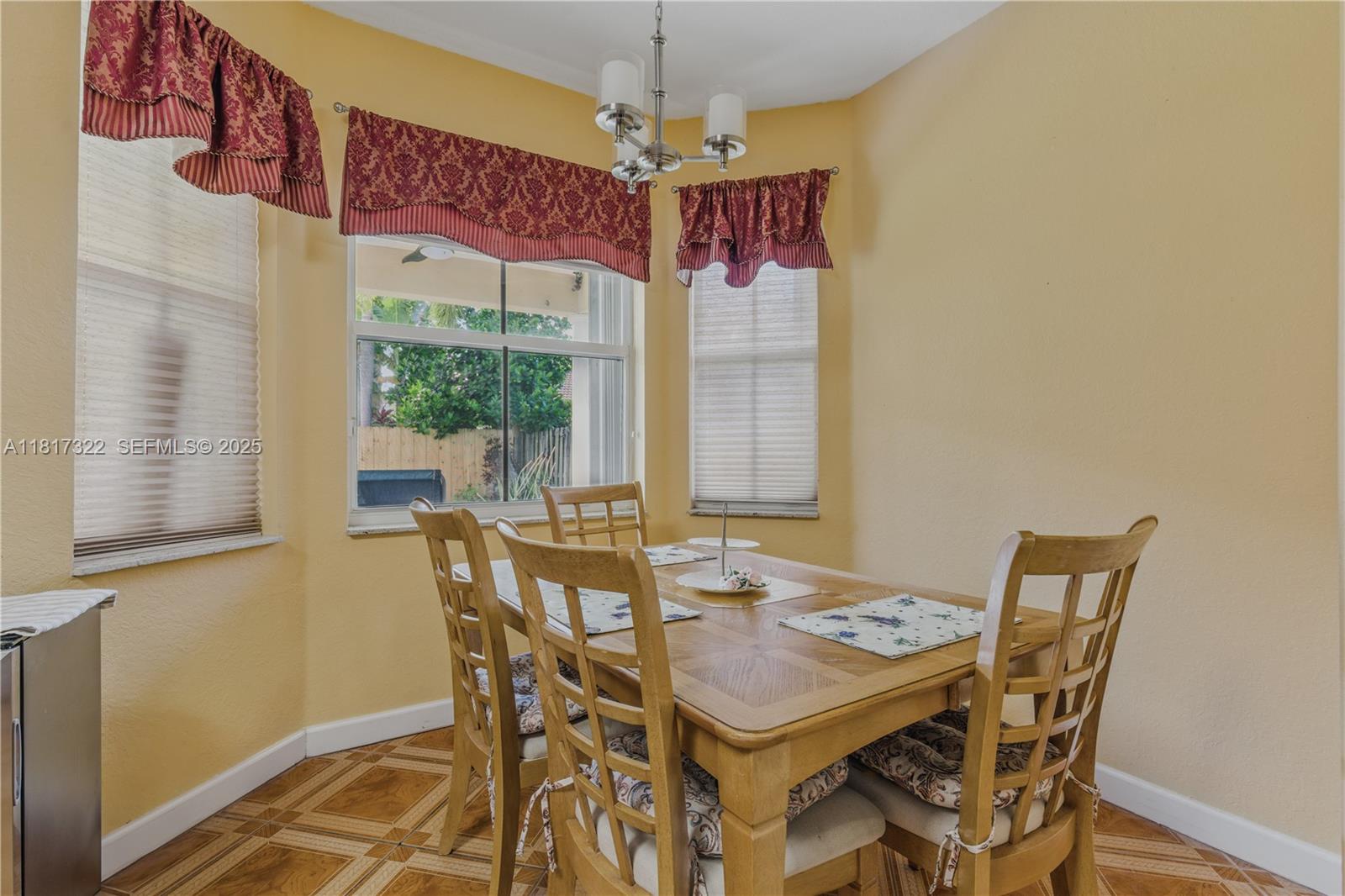 12251 Southwest 122nd Path Miami, FL 33186 - Photo 19 of 56 a view of a dining room with furniture window and outside view