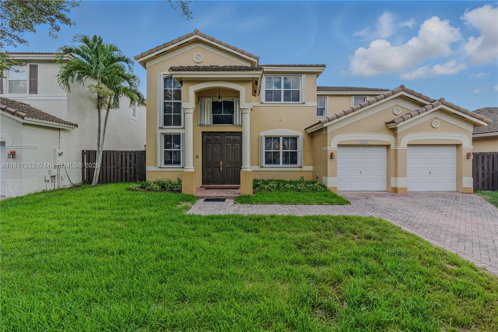 12251 Southwest 122nd Path Miami, FL 33186 - Photo 2 of 56 front view of a house with a yard