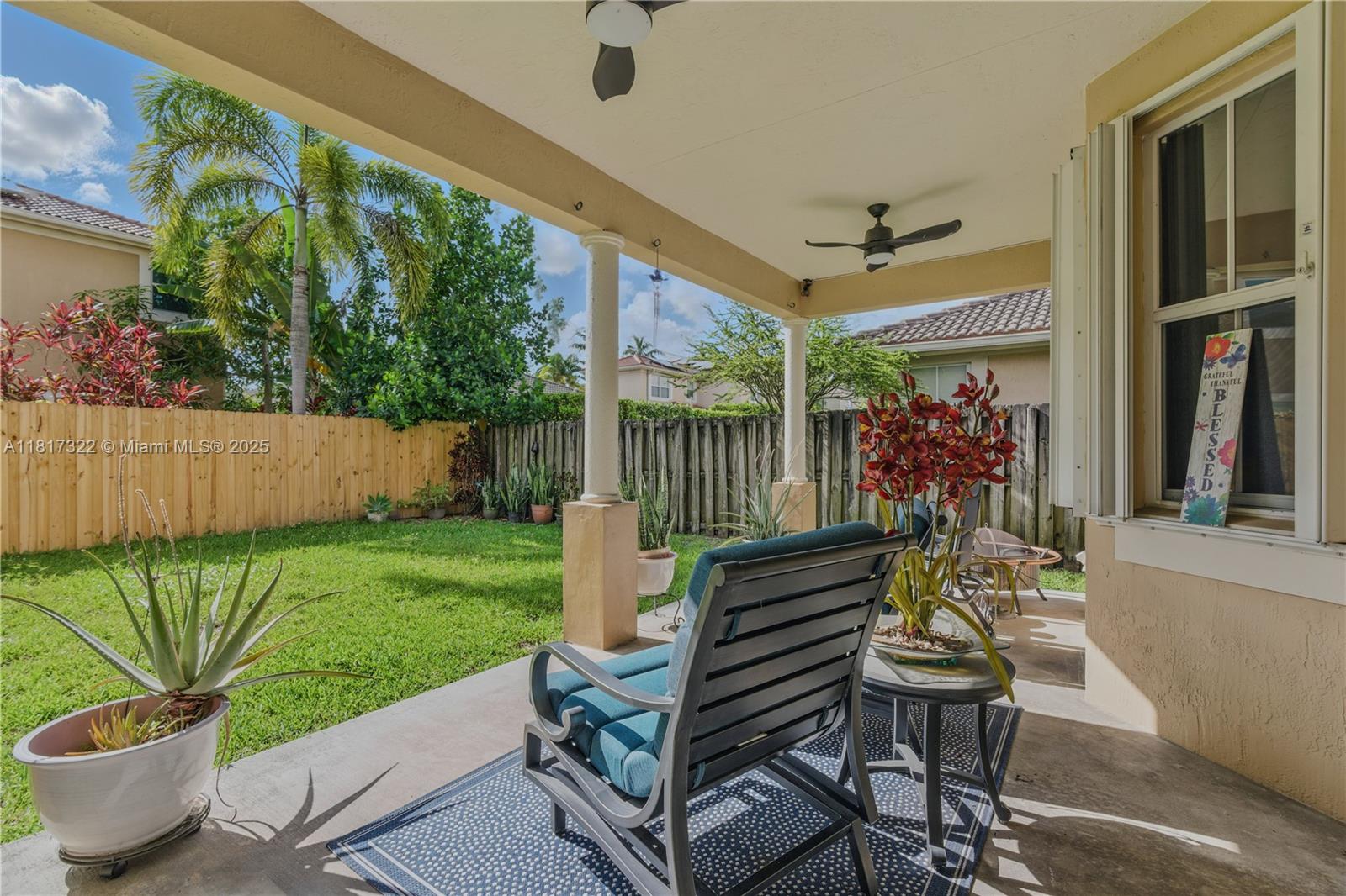 12251 Southwest 122nd Path Miami, FL 33186 - Photo 21 of 56 a outdoor living space with furniture and a garden