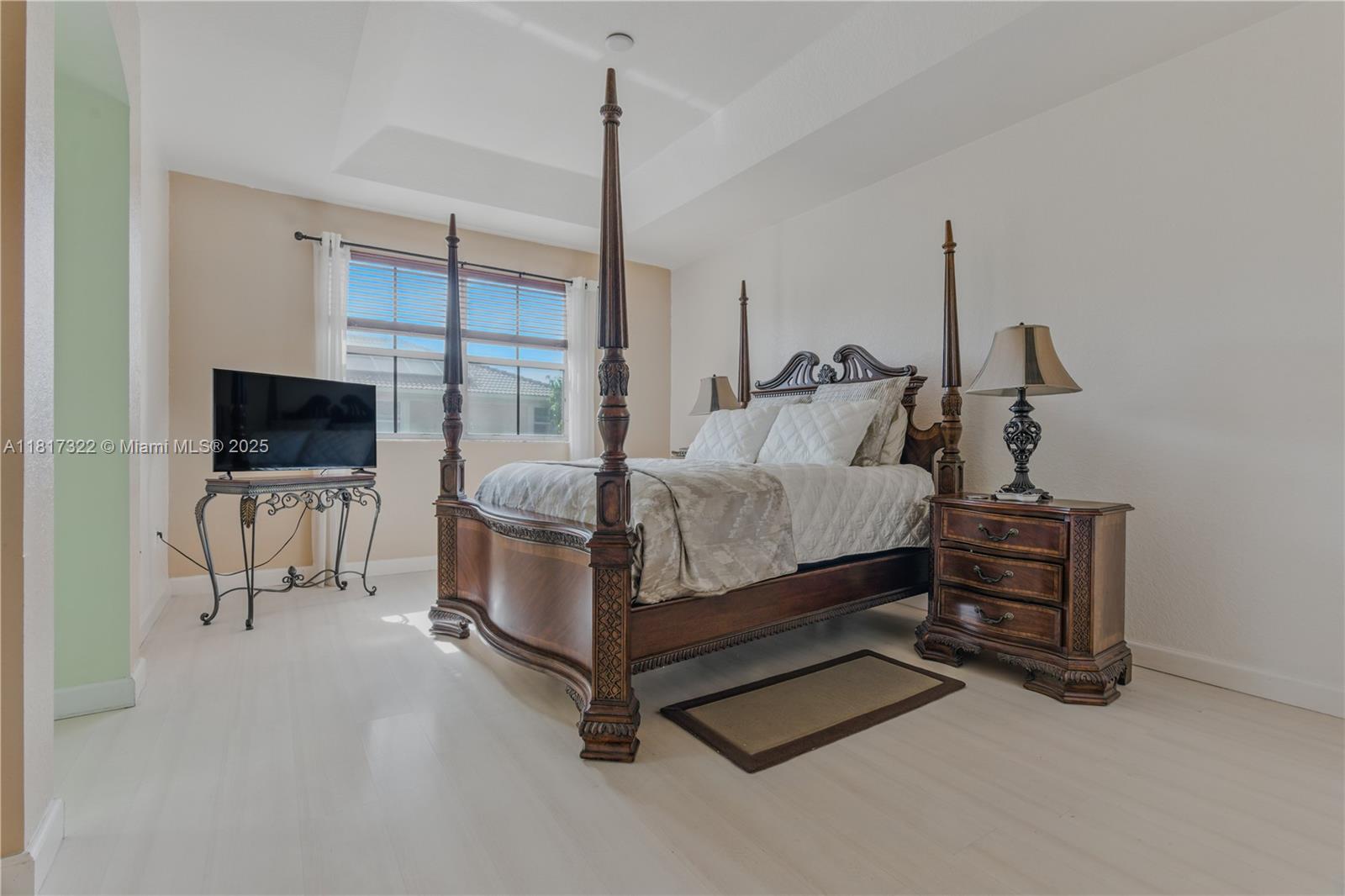 12251 Southwest 122nd Path Miami, FL 33186 - Photo 26 of 56 a bedroom with furniture a flat screen tv and a walk in closet