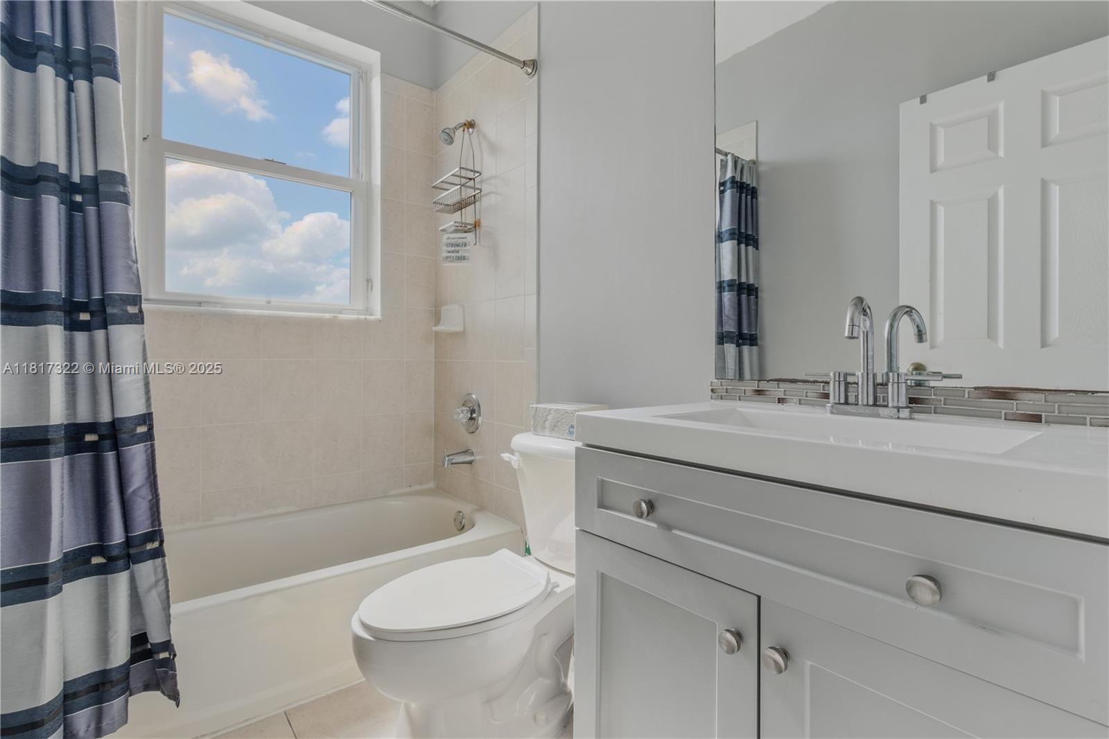 12251 Southwest 122nd Path Miami, FL 33186 - Photo 34 of 56 a bathroom with a sink a toilet and shower