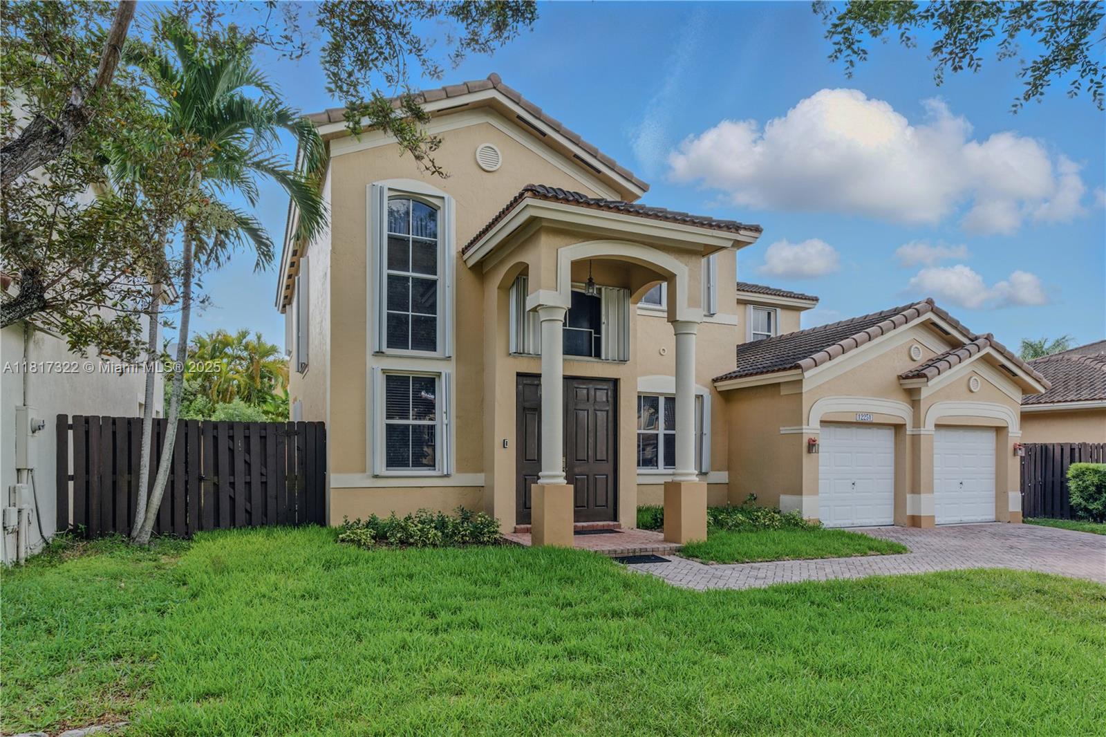 12251 Southwest 122nd Path Miami, FL 33186 - Photo 43 of 56 front view of a house with a yard