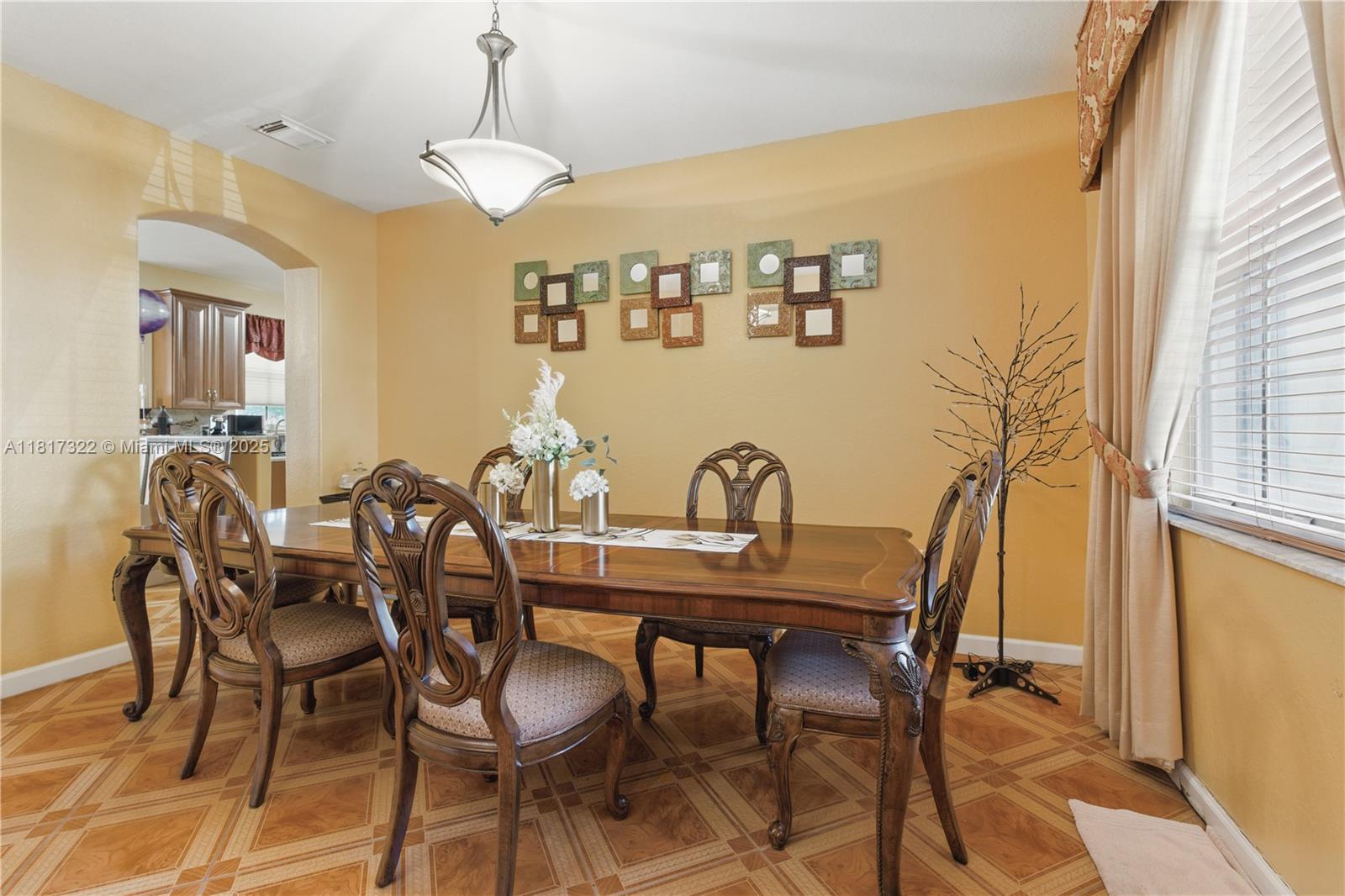 12251 Southwest 122nd Path Miami, FL 33186 - Photo 9 of 56 a view of a dining room with furniture and chandelier
