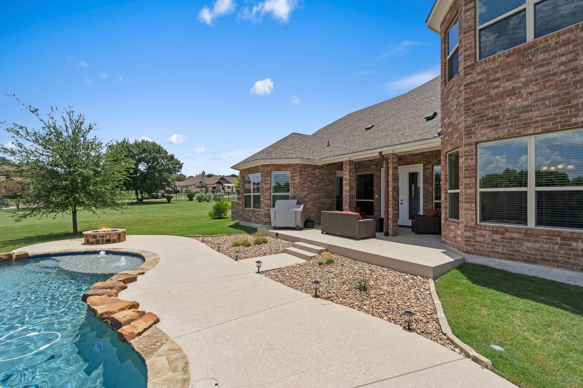 144 Indian Ridge Road Belton, TX 76513 - Photo 20 of 24 Outdoor pool with a patio area, a lawn, and outdoor lounge area