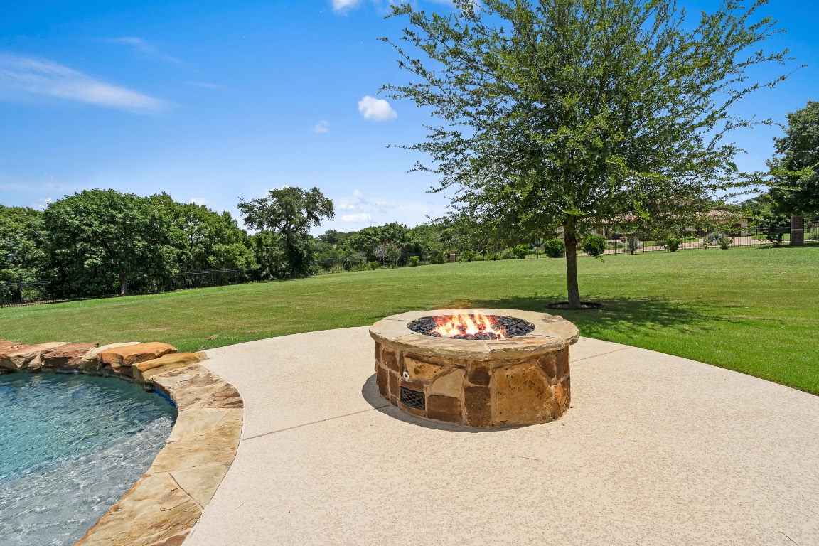 144 Indian Ridge Road Belton, TX 76513 - Photo 23 of 24 View of patio / terrace with an outdoor fire pit and an outdoor pool