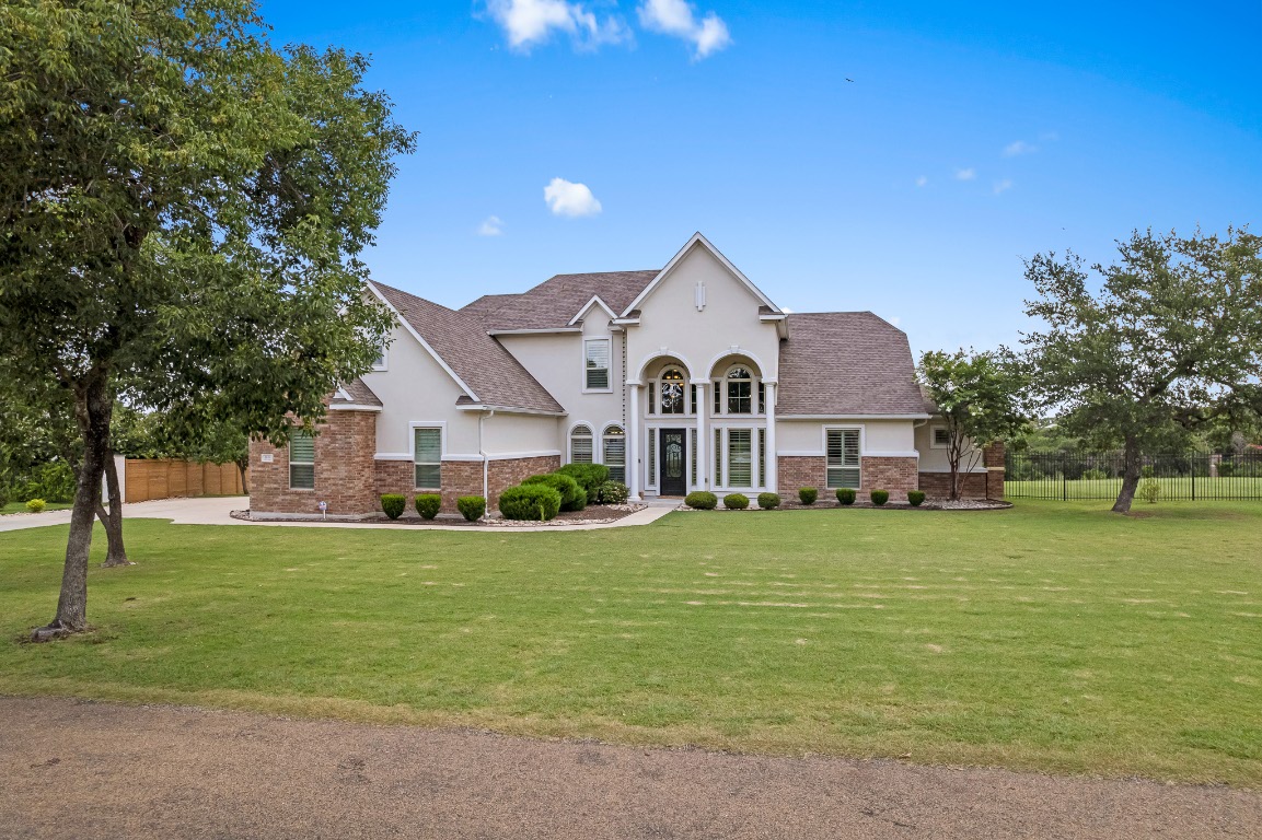 144 Indian Ridge Road Belton, TX 76513 - Photo 5 of 24 View of front of home with stucco siding, roof with shingles, and brick siding