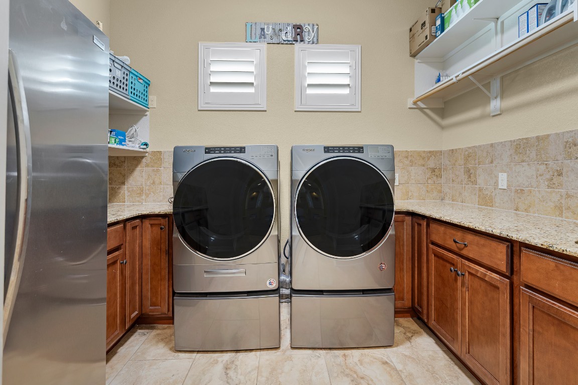 144 Indian Ridge Road Belton, TX 76513 - Photo 9 of 24 Washroom with separate washer and dryer and cabinet space