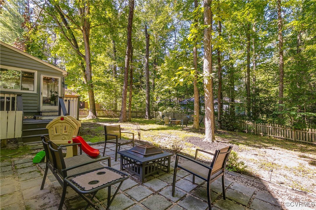13906 Barnes Spring Road Midlothian, VA 23112 - Photo 42 of 45 a backyard of a house with table and chairs
