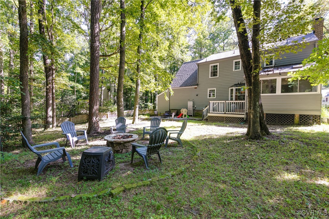 13906 Barnes Spring Road Midlothian, VA 23112 - Photo 45 of 45 a backyard of a house with table and chairs