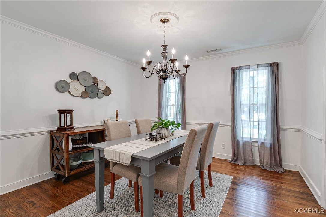 13906 Barnes Spring Road Midlothian, VA 23112 - Photo 9 of 45 a view of a dining room with furniture window and wooden floor