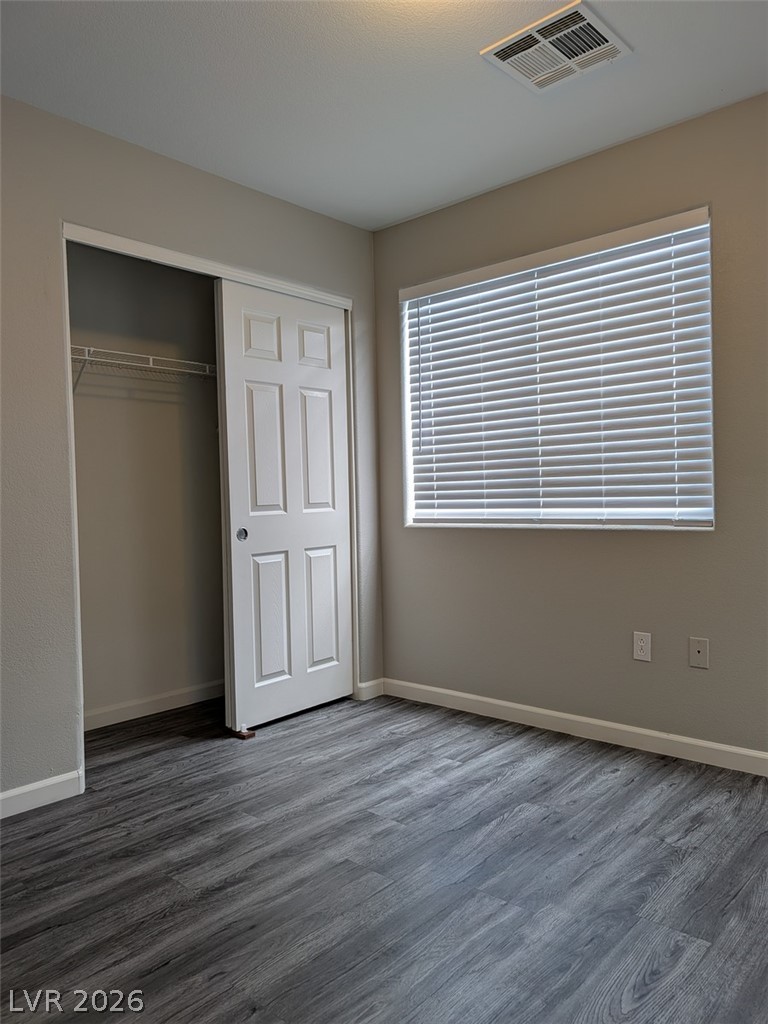 10308 Faustine Avenue Las Vegas, NV 89129 - Photo 24 of 28 Well-lit sleeping quarters with a convenient sliding door closet and durable flooring.