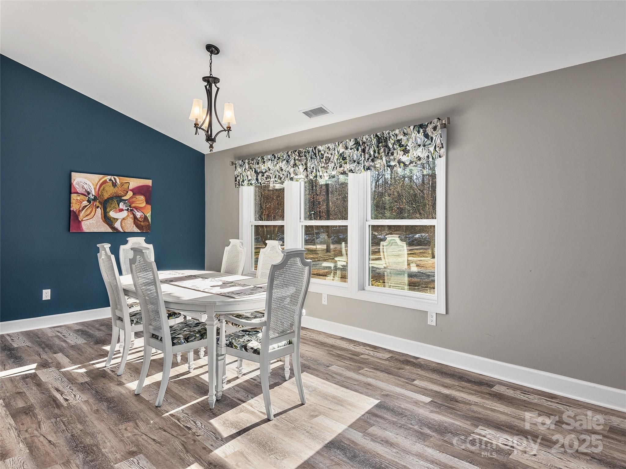 611 Peniel Road Columbus, NC 28722 - Photo 13 of 28 a dining room with furniture a chandelier and window