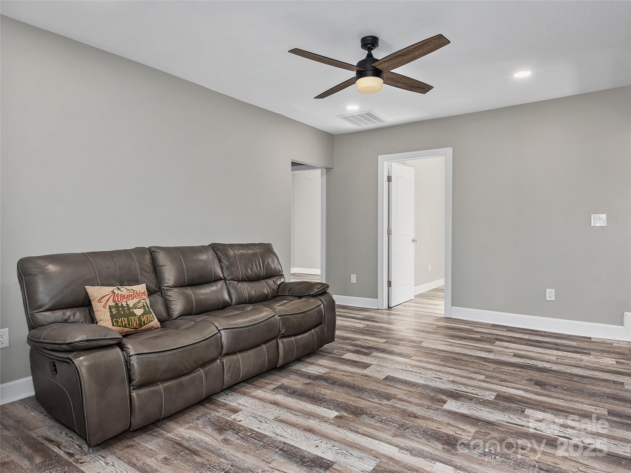 611 Peniel Road Columbus, NC 28722 - Photo 20 of 28 a living room with furniture and a ceiling fan