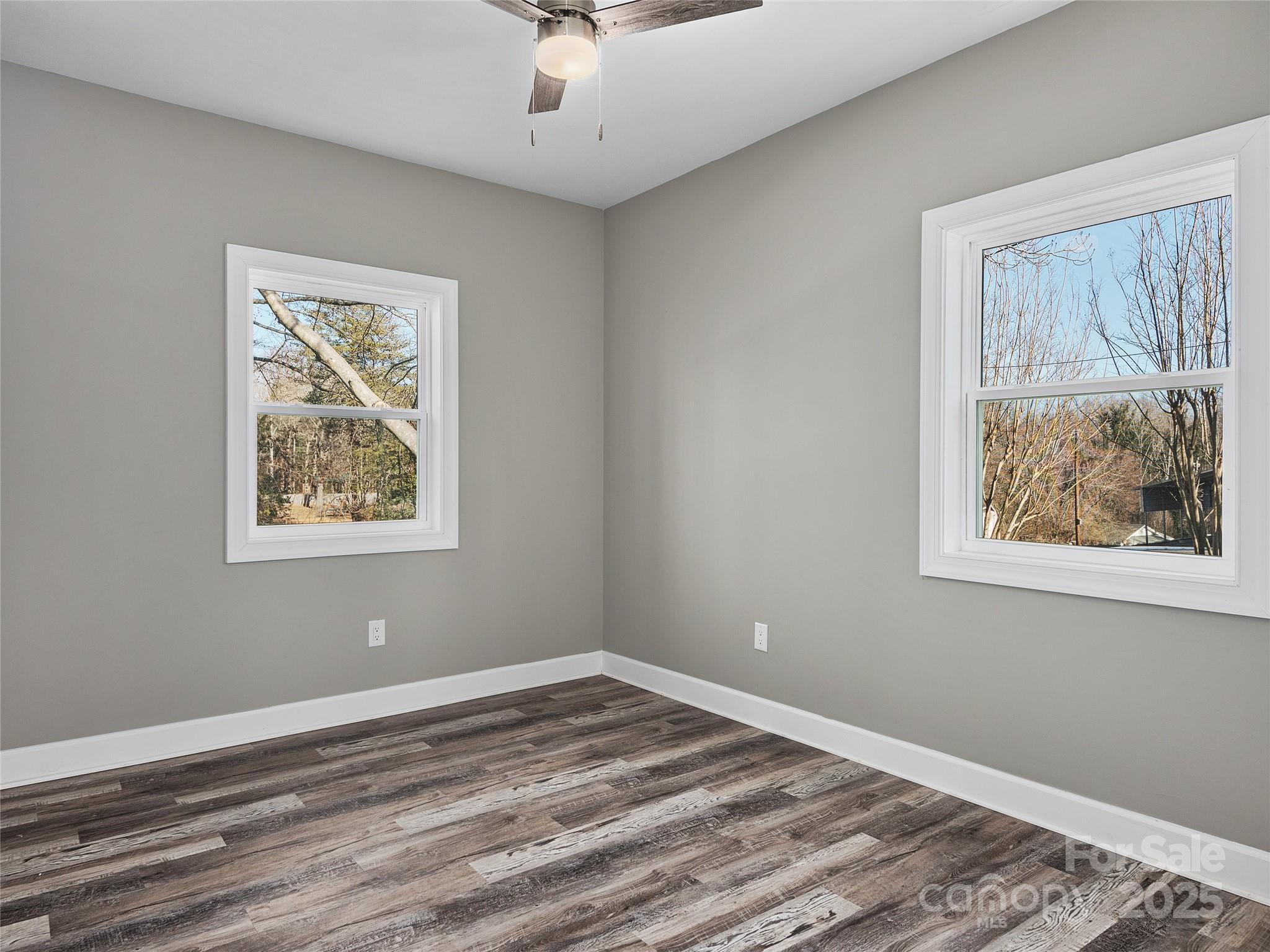 611 Peniel Road Columbus, NC 28722 - Photo 21 of 28 a view of room with window and wooden floor