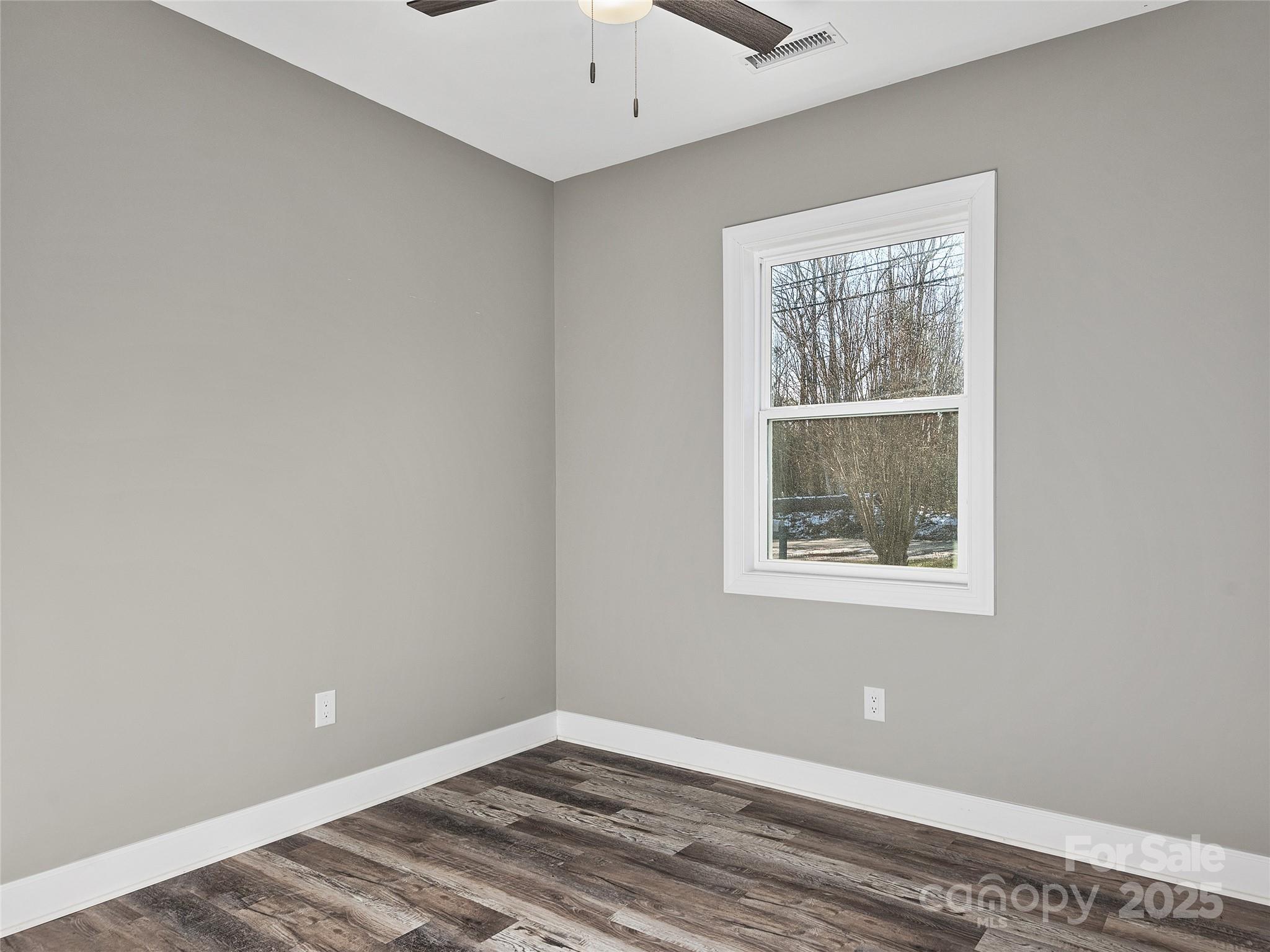 611 Peniel Road Columbus, NC 28722 - Photo 23 of 28 a view of an empty room with a window