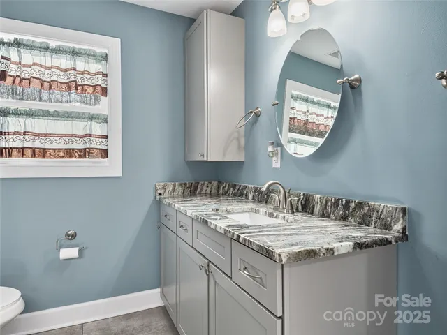 a bathroom with a bathtub and a toilet