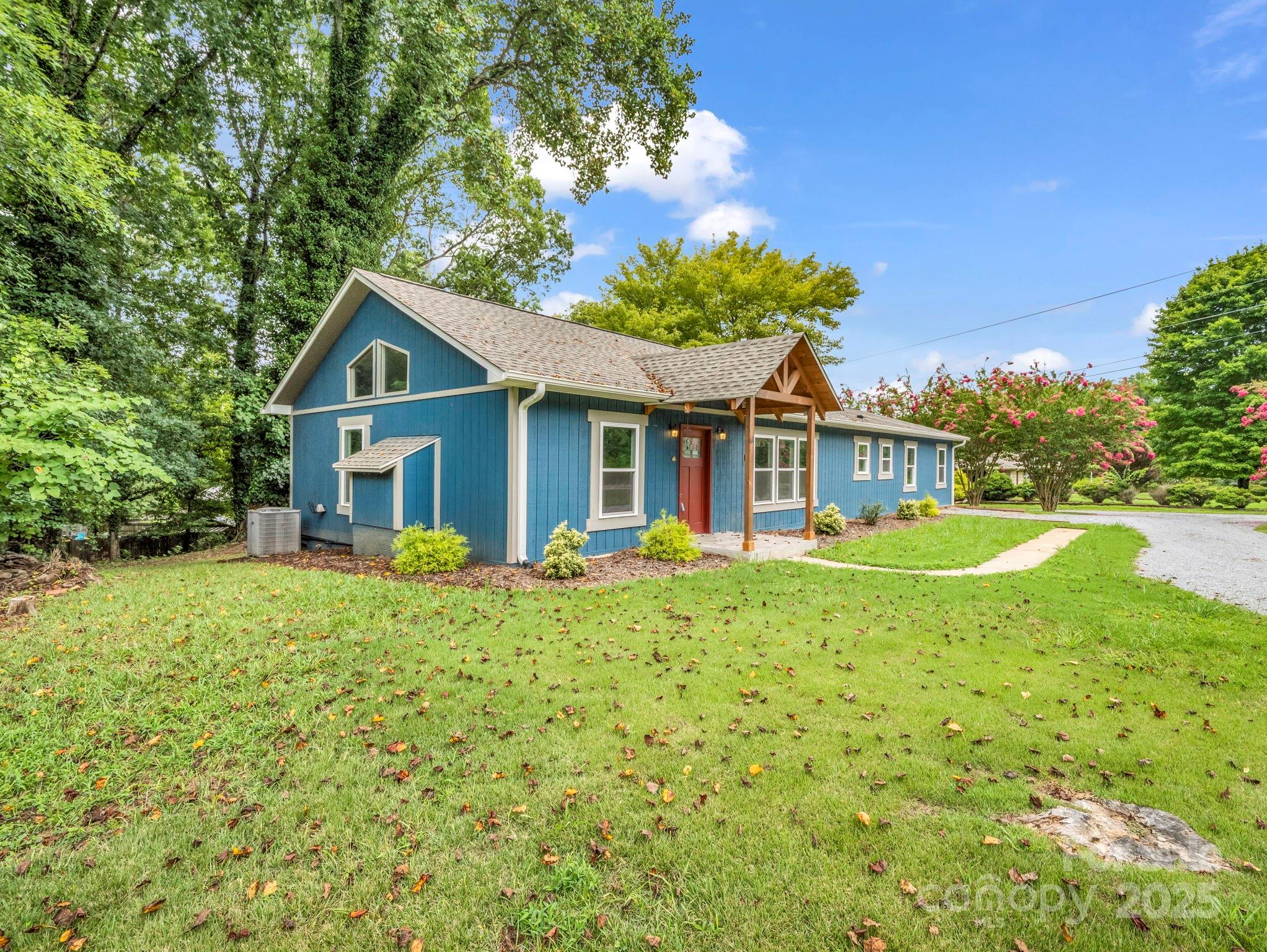 611 Peniel Road Columbus, NC 28722 - Photo 27 of 28 front view of a house with a yard