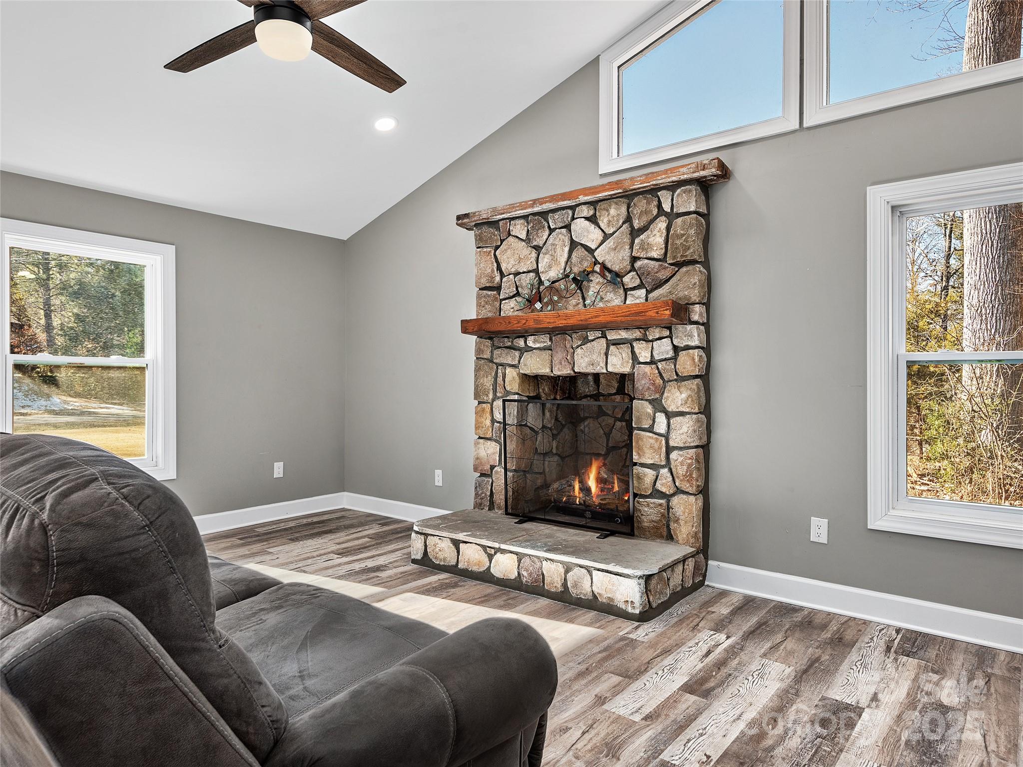 611 Peniel Road Columbus, NC 28722 - Photo 8 of 28 a bedroom with a bed a couch and window