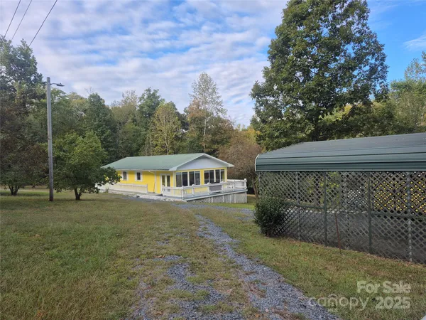 a view of a house with a yard
