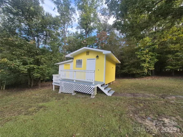 a balcony with wooden floor and fence