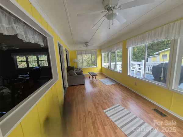 a kitchen with stainless steel appliances granite countertop a sink a stove and a wooden floors