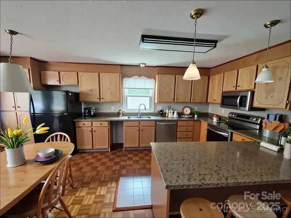 a view of a dining room with furniture window and outside view