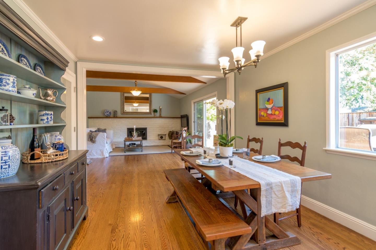 115 Belcrest Drive Los Gatos, CA 95032 - Photo 12 of 30 a view of a dining room with furniture a chandelier and wooden floor