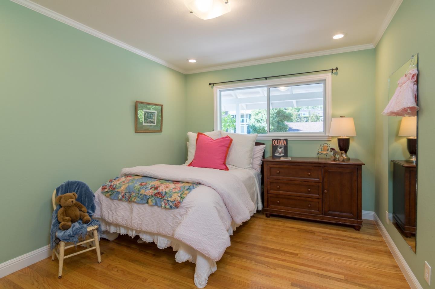 115 Belcrest Drive Los Gatos, CA 95032 - Photo 18 of 30 a bed room with a bed and a chair