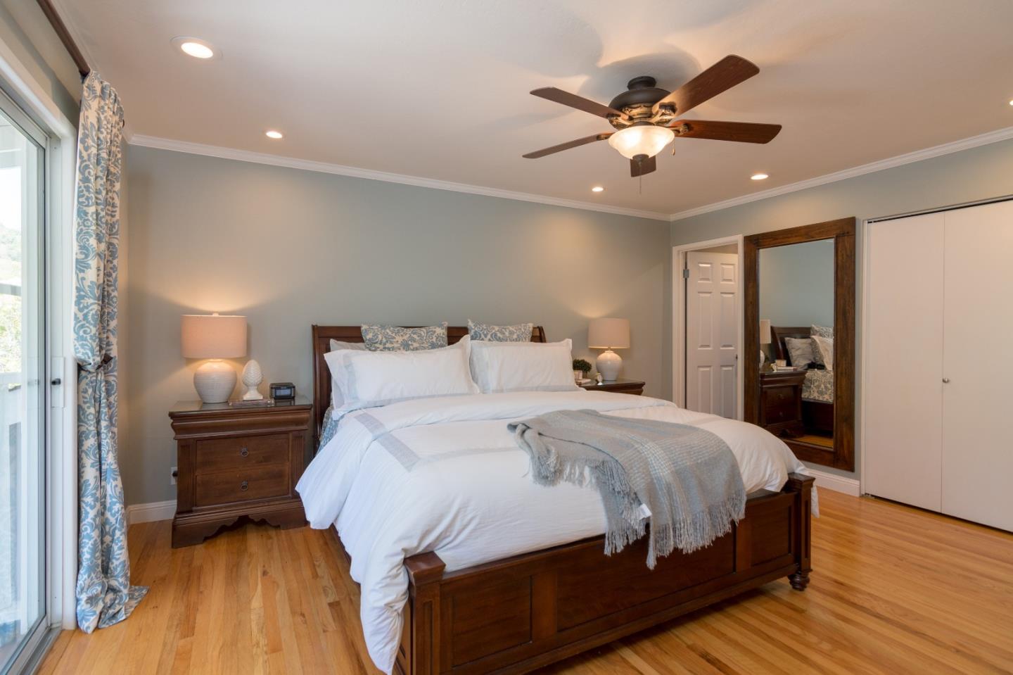 115 Belcrest Drive Los Gatos, CA 95032 - Photo 22 of 30 a bedroom with a bed and a ceiling fan