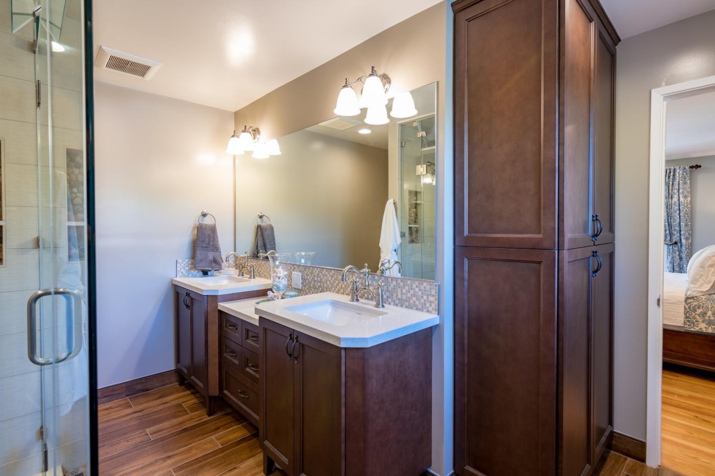 115 Belcrest Drive Los Gatos, CA 95032 - Photo 24 of 30 a bathroom with a granite countertop sink and a mirror