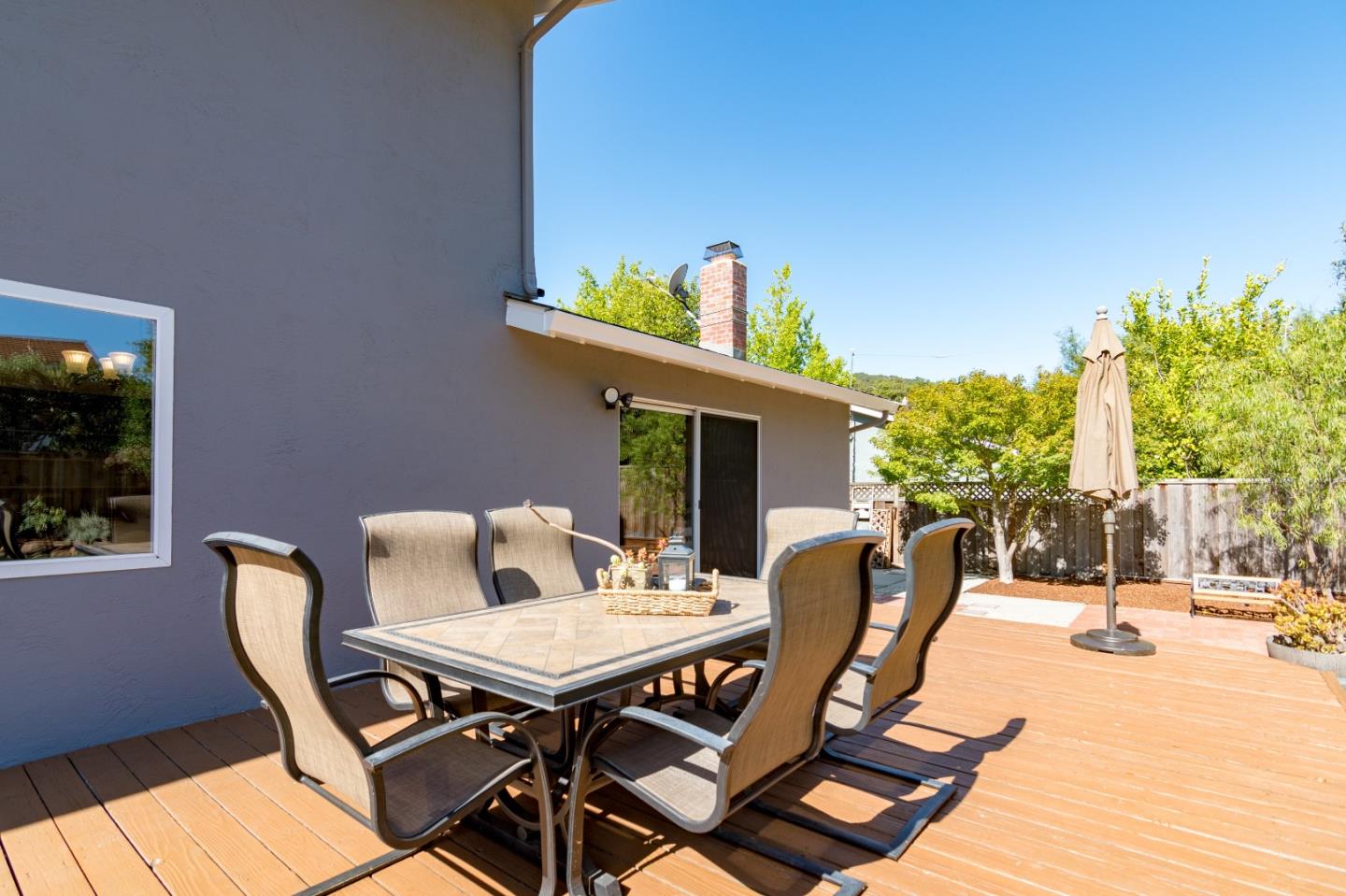 115 Belcrest Drive Los Gatos, CA 95032 - Photo 27 of 30 a view of a patio with a table and chairs