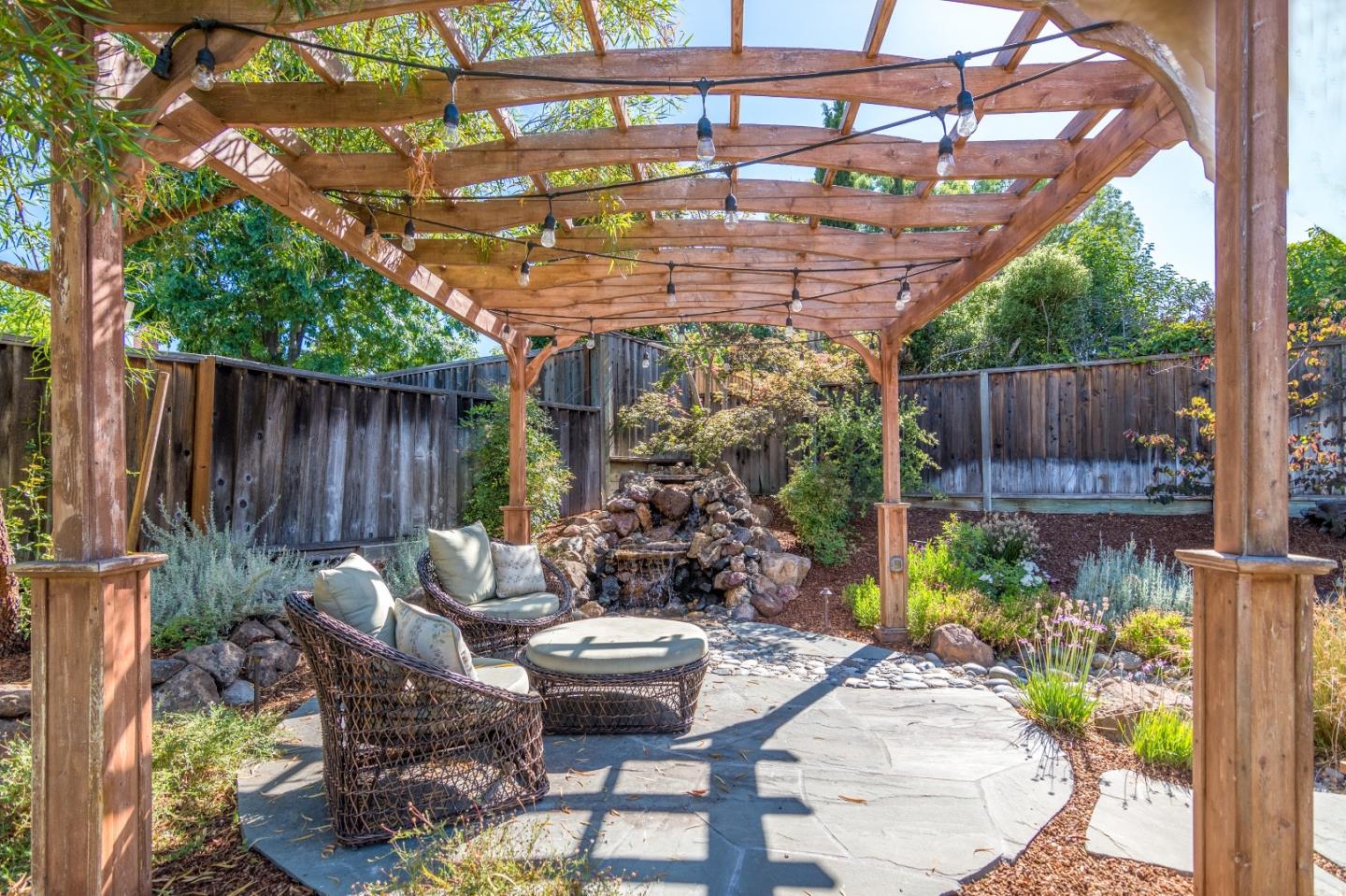 115 Belcrest Drive Los Gatos, CA 95032 - Photo 28 of 30 a view of patio with table and chairs potted plants with wooden floor