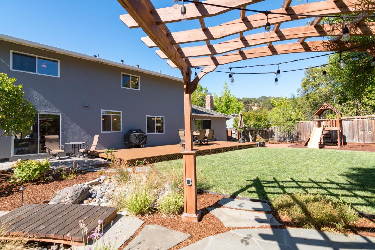 115 Belcrest Drive Los Gatos, CA 95032 - Photo 29 of 30 a view of a patio with table and chairs and potted plants