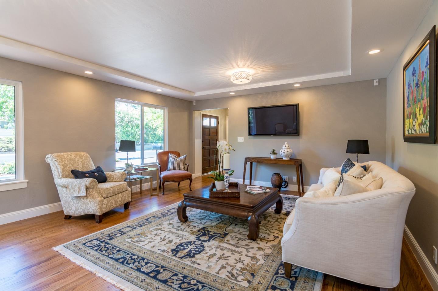 115 Belcrest Drive Los Gatos, CA 95032 - Photo 5 of 30 a living room with furniture and a flat screen tv
