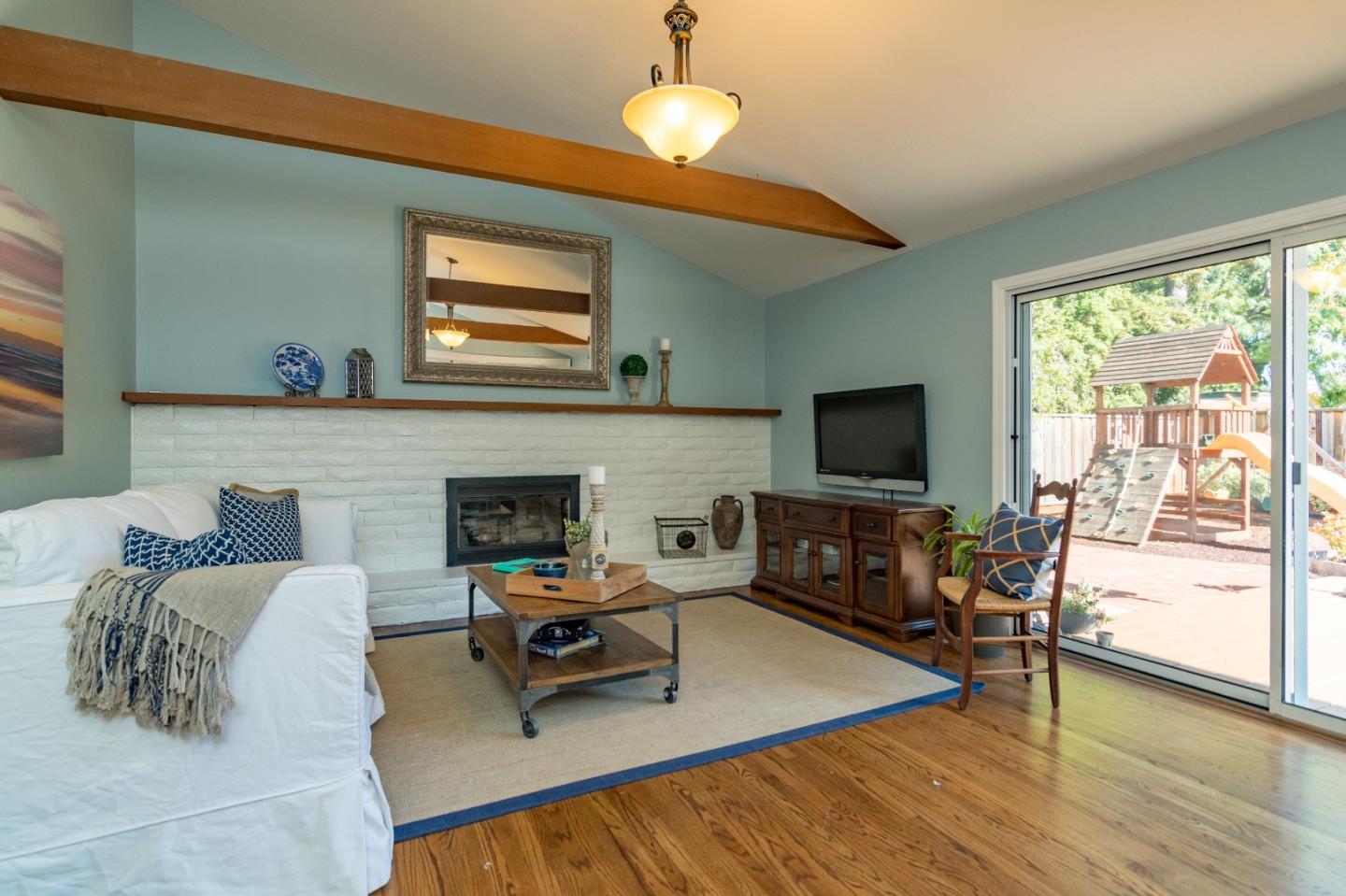 115 Belcrest Drive Los Gatos, CA 95032 - Photo 7 of 30 a living room with furniture and a fireplace