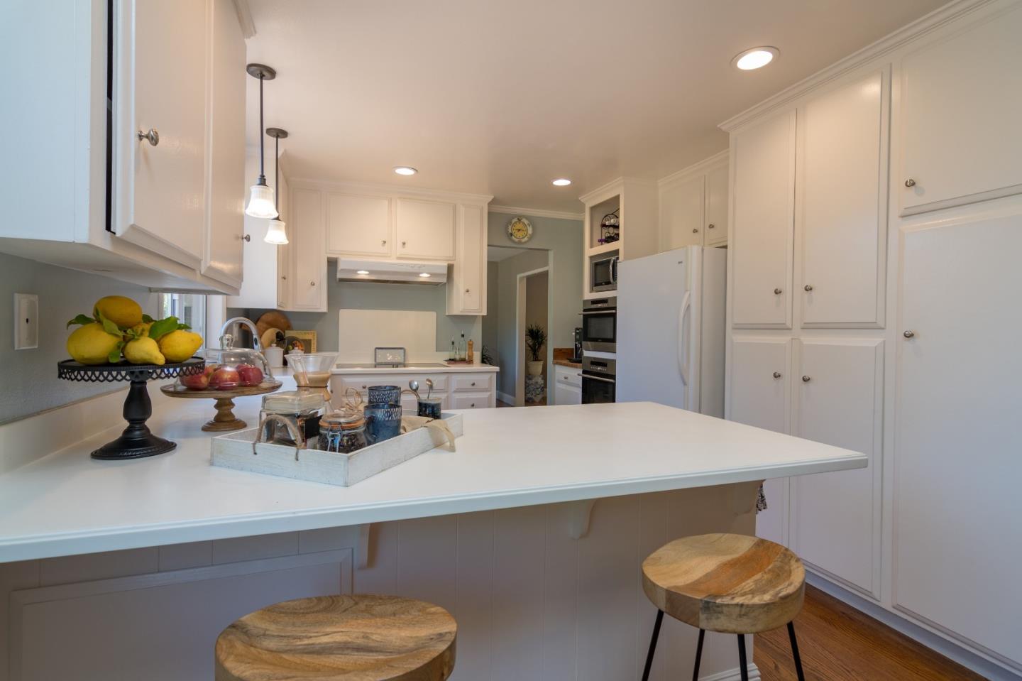 115 Belcrest Drive Los Gatos, CA 95032 - Photo 9 of 30 a kitchen with stainless steel appliances a sink and a refrigerator