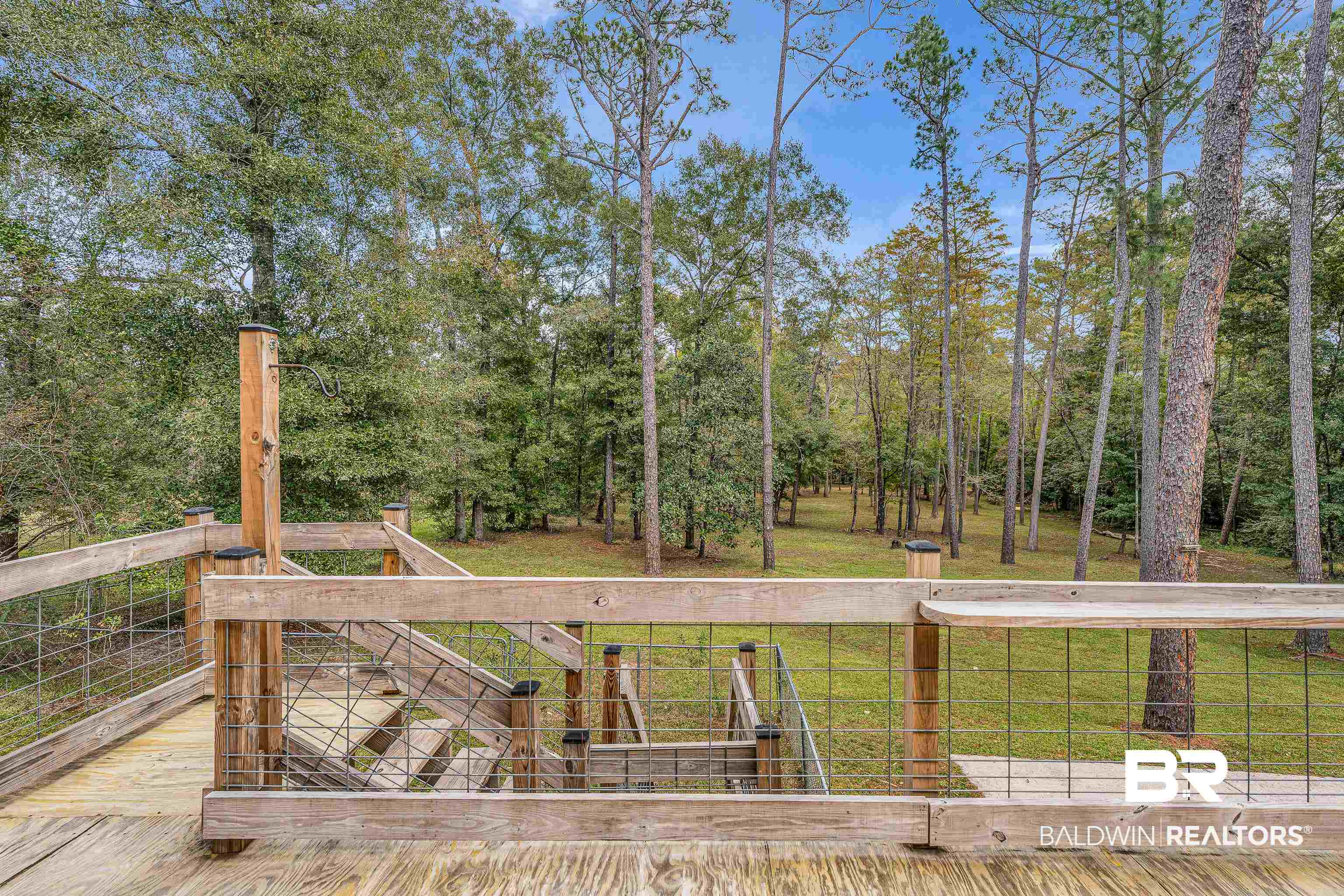 22970 River Road South Daphne, AL 36526 - Photo 24 of 48 View of green lawn with a wooden deck