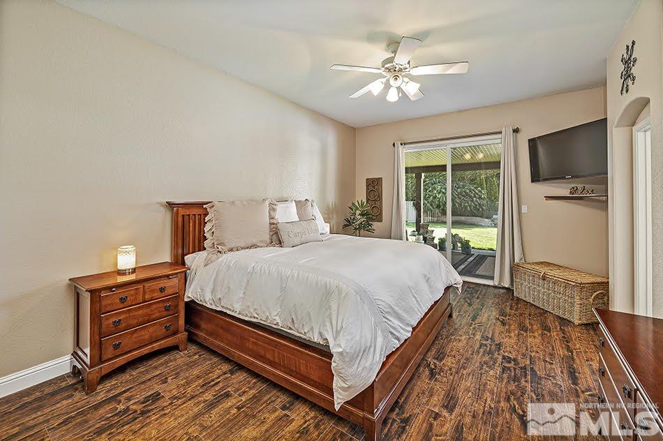 10010 Stonechase Court Reno, NV 89521 - Photo 11 of 33 a bed sitting in a spacious bedroom next to a window