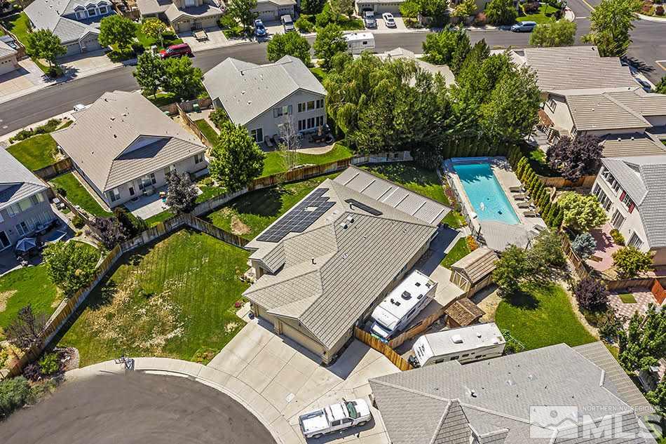 10010 Stonechase Court Reno, NV 89521 - Photo 31 of 33 an aerial view of a house with a yard and parking spaces