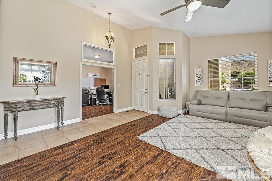 10010 Stonechase Court Reno, NV 89521 - Photo 5 of 33 a living room with furniture and a stove
