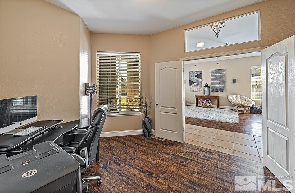 10010 Stonechase Court Reno, NV 89521 - Photo 10 of 33 a view of a workspace with furniture and a window