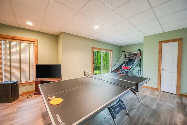 a view of a dining room with furniture and a flat screen tv