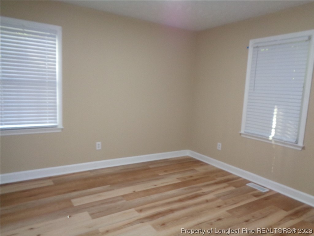 108 Dallas Street Lumberton, NC 28358 - Photo 14 of 15 a view of a room with wooden floor and a window