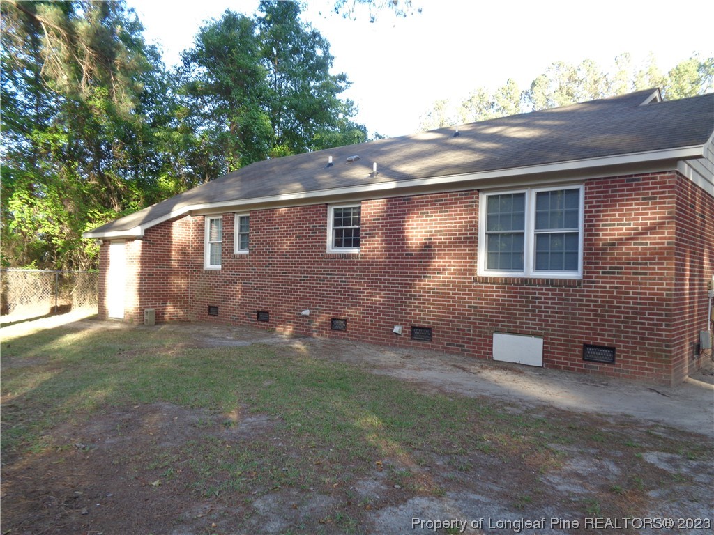 108 Dallas Street Lumberton, NC 28358 - Photo 2 of 15 a front view of a house with a yard and garage