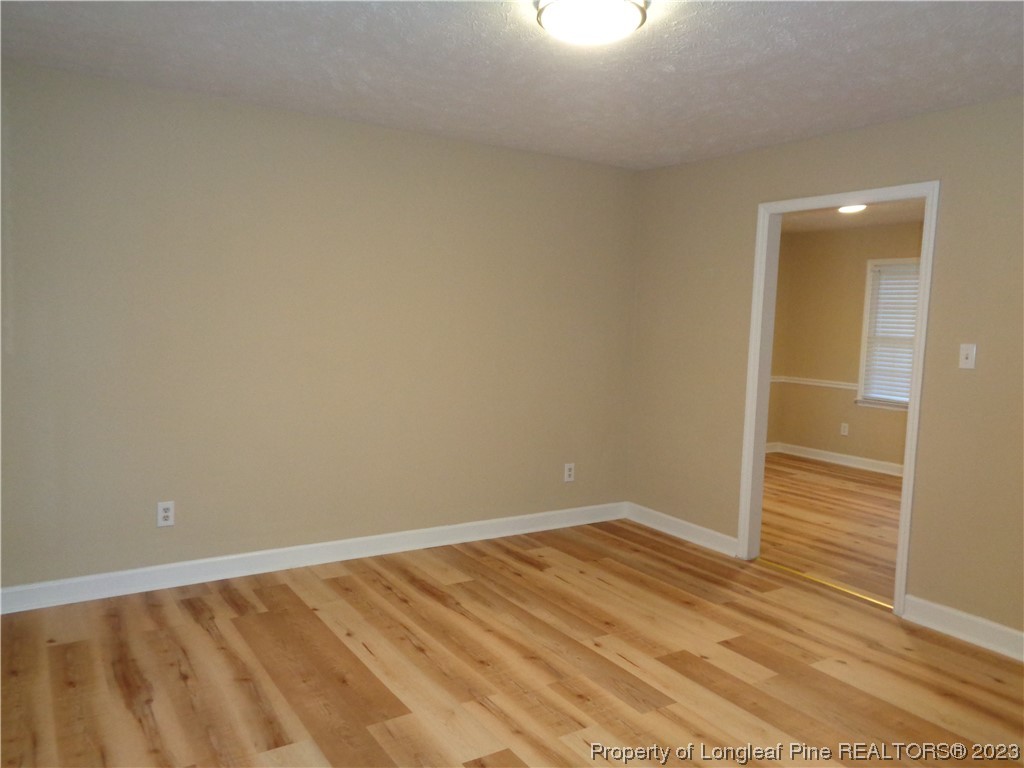 108 Dallas Street Lumberton, NC 28358 - Photo 6 of 15 a view of an empty room and wooden floor